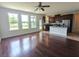 Open-concept living area with hardwood floors, plenty of natural light, and a view into the kitchen at 3254 Hartwell St, Johns Island, SC 29455