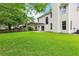 Expansive backyard features a well-maintained lawn, patio with pergola, and a charming two-story home at 3290 Middleburry Ln, Charleston, SC 29414