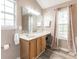 Bathroom featuring large window, towels, single sink vanity, and wood-look floors at 3290 Middleburry Ln, Charleston, SC 29414
