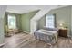 Tranquil bedroom with a sloped ceiling, two large windows, and wood-look flooring for a cozy feel at 3290 Middleburry Ln, Charleston, SC 29414
