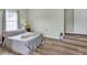 Comfortable bedroom featuring wood-look floors and a serene color palette, creating a relaxing retreat at 3290 Middleburry Ln, Charleston, SC 29414