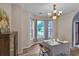 Dining room with natural light from the bay window and a formal china cabinet at 3290 Middleburry Ln, Charleston, SC 29414