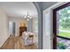 Open concept dining area with natural light flowing in and an arched entrance to the foyer at 3290 Middleburry Ln, Charleston, SC 29414