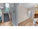 Bright foyer with staircase, hardwood floors, and view into the dining area at 3290 Middleburry Ln, Charleston, SC 29414