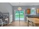 A spacious kitchen with wood cabinets, stainless steel appliances, and a sliding door to the outside at 3290 Middleburry Ln, Charleston, SC 29414