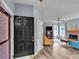 Inviting living room featuring a brick fireplace, hardwood floors, and stylish furniture at 3290 Middleburry Ln, Charleston, SC 29414