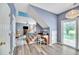 Open living space with staircase, desk area, and access to the patio at 3290 Middleburry Ln, Charleston, SC 29414