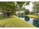 Beautiful pond reflecting the surrounding trees and greenery, creating a tranquil and picturesque setting at 3290 Middleburry Ln, Charleston, SC 29414