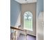 Stairway with large window for natural light looking out at backyard and trees at 3290 Middleburry Ln, Charleston, SC 29414