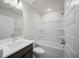 Bathroom boasts a modern vanity, mirror, and a shower-tub combo with white tile surround at 335 Bremerton Dr, Goose Creek, SC 29445