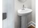 Close-up of a pedestal sink with chrome faucet in a stylish bathroom at 335 Bremerton Dr, Goose Creek, SC 29445