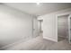 Bright bedroom with neutral carpet, white trim, and access to a walk-in closet at 335 Bremerton Dr, Goose Creek, SC 29445