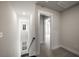 Upstairs hallway leading to an interior bedroom with natural light at 335 Bremerton Dr, Goose Creek, SC 29445