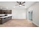 A modern kitchen featuring stainless steel appliances, dark brown cabinets, and a center island at 335 Bremerton Dr, Goose Creek, SC 29445