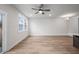 Spacious living room with light wood floors, ceiling fan, and large windows at 335 Bremerton Dr, Goose Creek, SC 29445