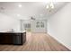 Open-concept living area with light wood floors, ceiling fan, and sliding glass doors to the outside at 335 Bremerton Dr, Goose Creek, SC 29445