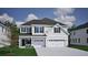 Charming two-story home with attached two-car garage and covered front porch at 3429 Seaton Street, Summerville, SC 29486