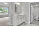 Bathroom with quartz countertop, white cabinets, marble floors, and a view of the bedroom and toilet room at 327 Hillman Trl Dr, Moncks Corner, SC 29461