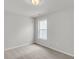 Bright bedroom with natural light, plush carpeting, and a window offering views of the surrounding area at 327 Hillman Trl Dr, Moncks Corner, SC 29461