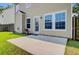 Backyard featuring a concrete patio and a well-maintained lawn at 3706 Blackjack Rd, Ladson, SC 29456