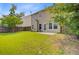 Backyard featuring a concrete patio and a well-maintained lawn with a wood fence at 3706 Blackjack Rd, Ladson, SC 29456