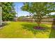 Backyard featuring a well-maintained lawn with a wood fence at 3706 Blackjack Rd, Ladson, SC 29456