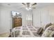 Comfortable bedroom featuring a trey ceiling, ceiling fan, and a television at 3706 Blackjack Rd, Ladson, SC 29456