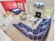 Expansive living area with high ceilings, fireplace, and comfortable seating arrangements at 3706 Blackjack Rd, Ladson, SC 29456