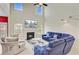 Bright living room boasts a fireplace, soaring ceilings, and comfortable blue seating at 3706 Blackjack Rd, Ladson, SC 29456