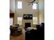 Two-story living room boasts abundant natural light, a fireplace, and stylish furnishings for a comfortable gathering space at 3706 Blackjack Rd, Ladson, SC 29456
