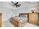 Comfortable primary bedroom with a trey ceiling, ceiling fan, and well-coordinated furnishings at 3706 Blackjack Rd, Ladson, SC 29456