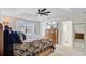 Inviting primary bedroom featuring a trey ceiling, ceiling fan, and a television at 3706 Blackjack Rd, Ladson, SC 29456