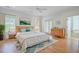 Staged bedroom with hardwood floors and a large bed at 400 Bay Crossing Rd, Mount Pleasant, SC 29464