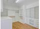 Walk-in closet with custom shelving, hanging racks, and storage drawers at 400 Bay Crossing Rd, Mount Pleasant, SC 29464