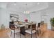 Formal dining room featuring table with seating for six, chandelier, and access to the kitchen at 400 Bay Crossing Rd, Mount Pleasant, SC 29464