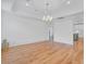Bright dining room with hardwood floors, chandelier, and an archway to an adjacent kitchen at 400 Bay Crossing Rd, Mount Pleasant, SC 29464