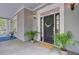 Charming entryway featuring a stylish front door, potted plants, and a 'Welcome' mat at 400 Bay Crossing Rd, Mount Pleasant, SC 29464