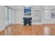 Spacious living room features a fireplace, built-in shelving, and French doors to an outdoor patio at 400 Bay Crossing Rd, Mount Pleasant, SC 29464