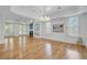 Spacious living room with hardwood floors, fireplace, built-in shelves, and access to an outdoor space at 400 Bay Crossing Rd, Mount Pleasant, SC 29464