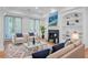 Comfortable living room boasts a modern fireplace, plush seating, and access to an outdoor space at 400 Bay Crossing Rd, Mount Pleasant, SC 29464
