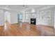 Open-concept living room with a fireplace, hardwood floors, and recessed lighting at 400 Bay Crossing Rd, Mount Pleasant, SC 29464