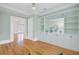 Office area with custom built-ins and French doors overlooking a balcony and spacious room at 400 Bay Crossing Rd, Mount Pleasant, SC 29464