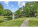Picturesque community pond with a water fountain surrounded by lush greenery at 400 Bay Crossing Rd, Mount Pleasant, SC 29464