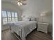 Bedroom with a white wrought-iron bed, ceiling fan and ample natural light from the window at 4013 Conant Rd, Mount Pleasant, SC 29466
