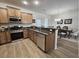 Updated kitchen with wood cabinetry, granite counters, and stainless steel appliances at 4013 Conant Rd, Mount Pleasant, SC 29466