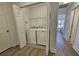 Convenient laundry room closet with a washer, dryer, shelving, and neutral flooring at 4013 Conant Rd, Mount Pleasant, SC 29466