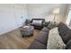 Comfortable living room with plush seating, stylish ottoman, and modern lamp creating a cozy atmosphere at 4013 Conant Rd, Mount Pleasant, SC 29466