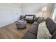 Comfortable living room with plush seating, stylish ottoman, and modern lamp creating a cozy atmosphere at 4013 Conant Rd, Mount Pleasant, SC 29466