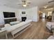 Open-concept living room with fireplace and view of the dining area and kitchen at 4013 Conant Rd, Mount Pleasant, SC 29466