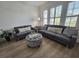 Cozy living room featuring sofas and a patterned ottoman for a relaxing atmosphere at 4013 Conant Rd, Mount Pleasant, SC 29466